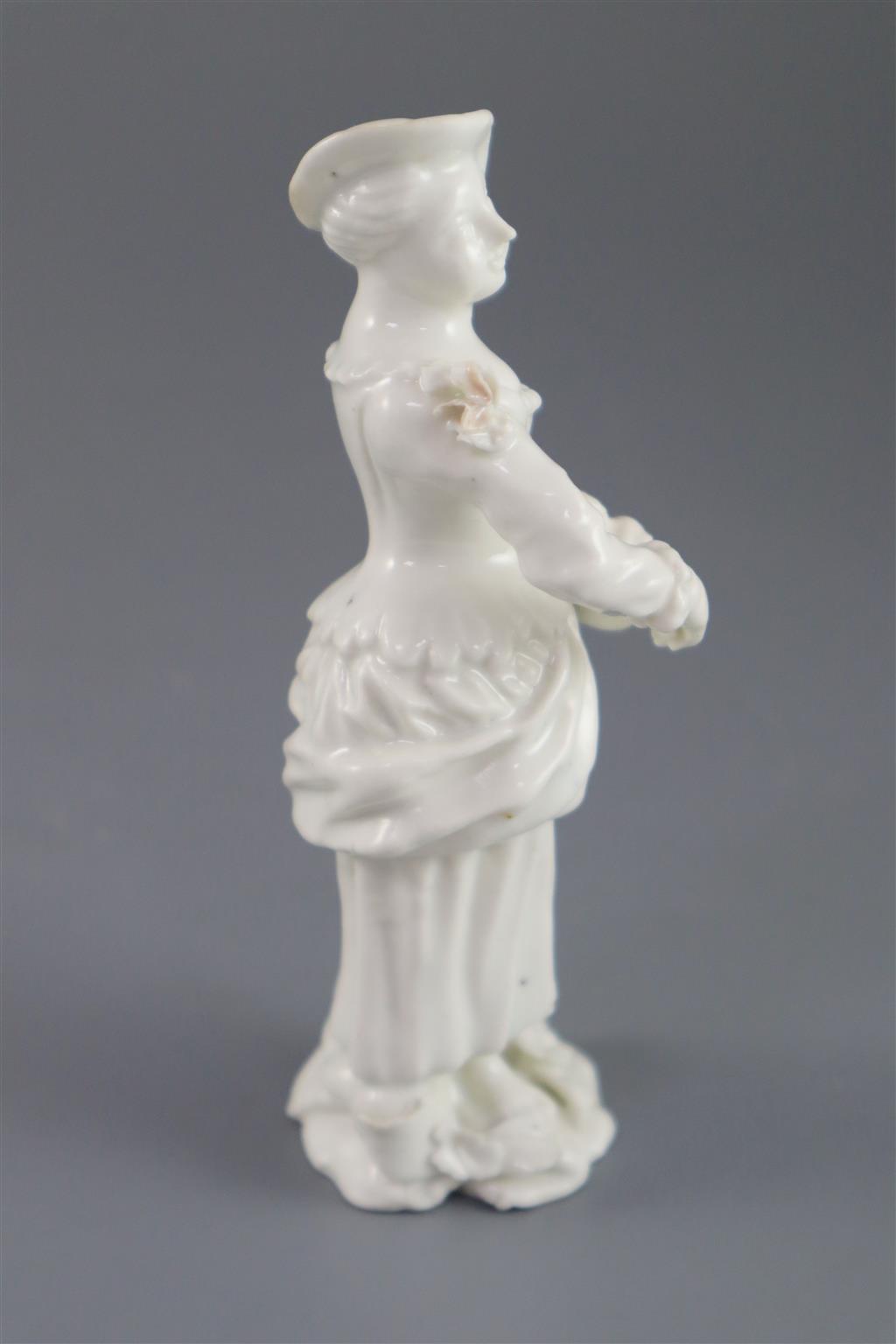 A rare French porcelain figure of a lady playing the Hurdy Gurdy, probably Orleans, c.1756-58, 13cm high